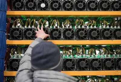 An expansive Bitcoin mining farm with rows of working miners