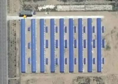 Mining farm server racks, showcasing the scale and potential energy consumption of a large mining operation